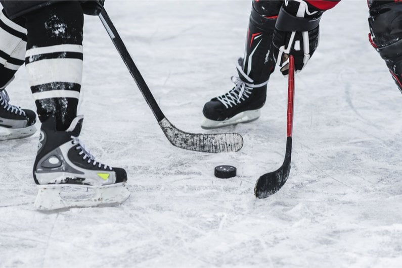 NHL players battling for the puck