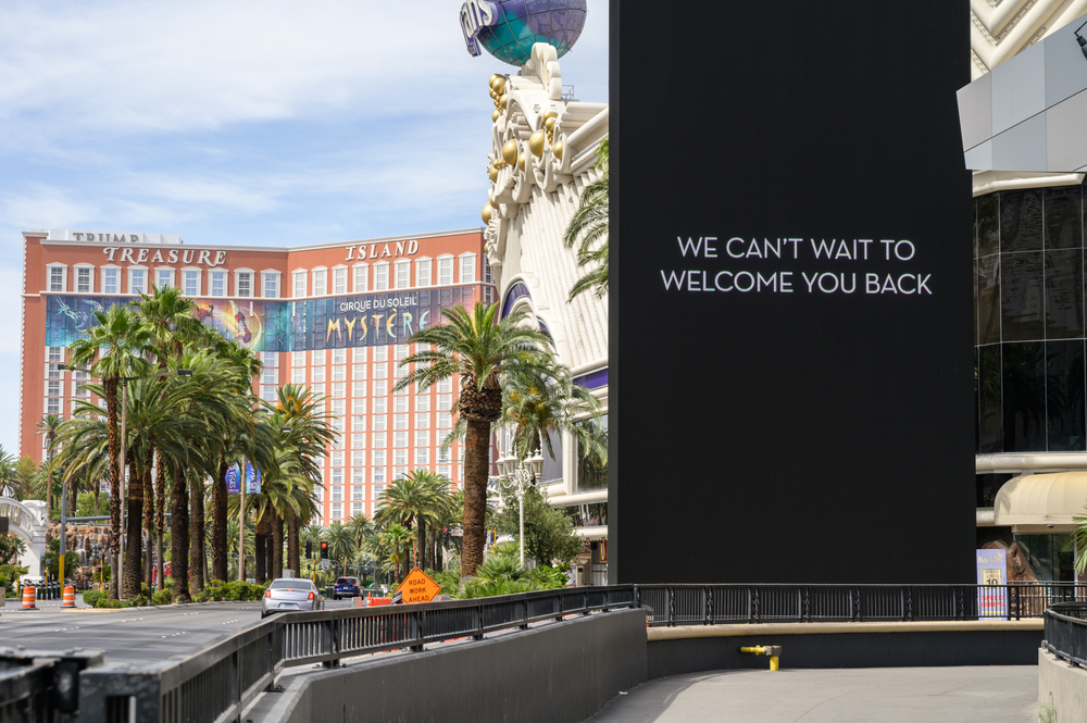 Sign in Las Vegas during COVID-19 pandemic reads we can't wait to welcome you back